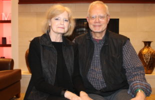 Karen and Mark Weidner sitting in the living room.