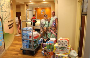 Carol McCloud and her family dropping off items from their wish list drive.