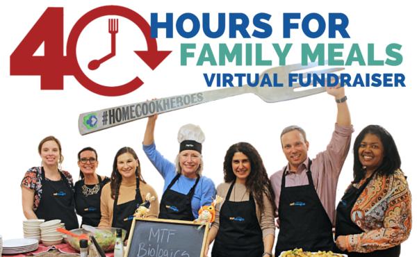 40 hours for family meals fundraiser with smiling volunteers holding fork