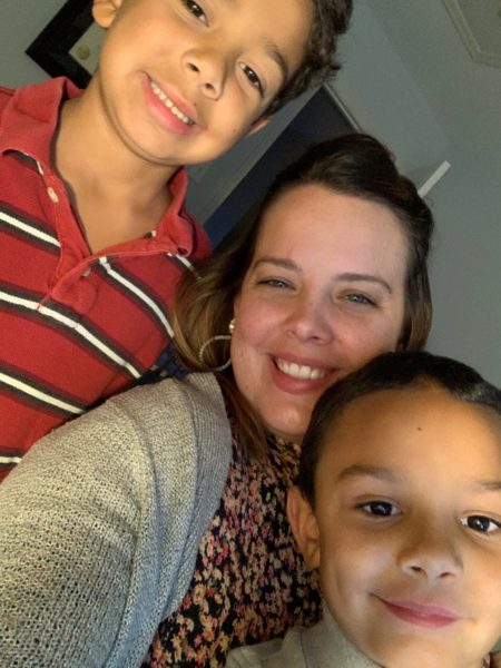 Woman with two sons smiling selfie