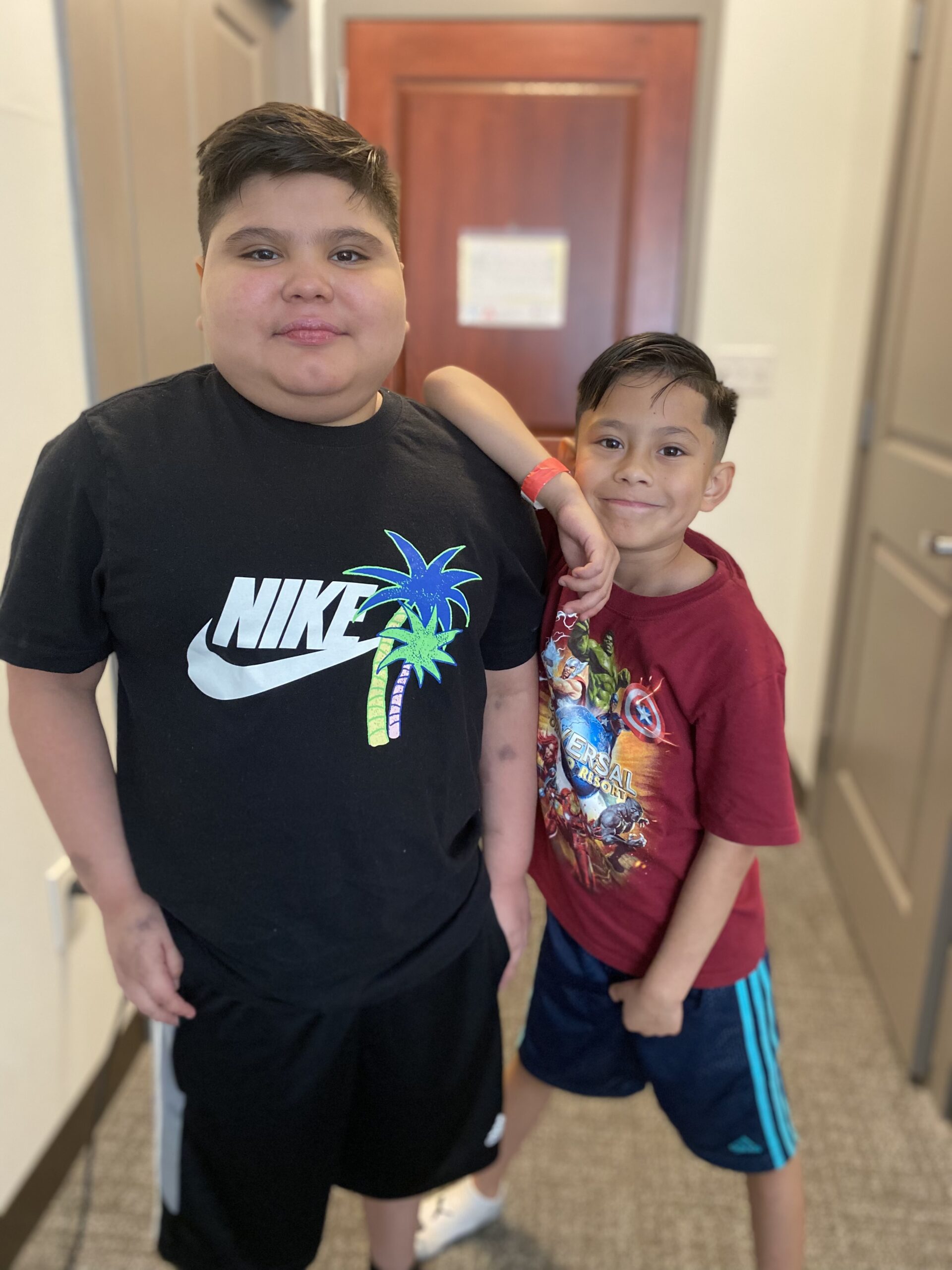 Anthony Rojas standing with his younger brother Dylan