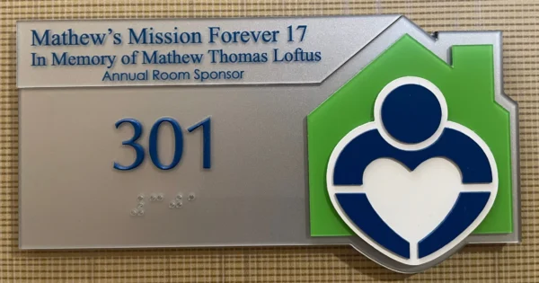 Room Sponsor signage: Matthew's Mission Forever 17 in Memory of Mathew Thomas Loftus