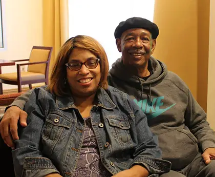 a woman and a man at howie's house