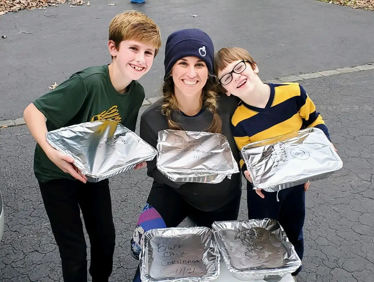 mother with kids serving food