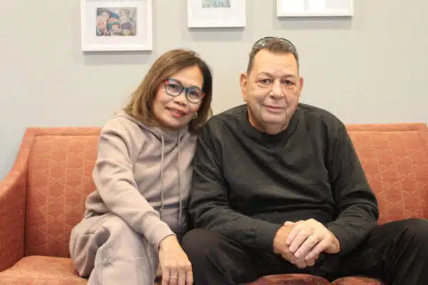 husband and wife sitting on couch