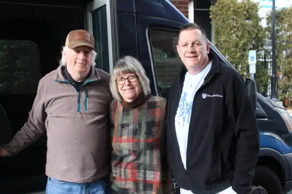 guest family in front of shuttle